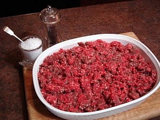 Seasoned ground bison ready to be formed into patties.