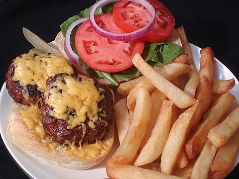 Double bison burger with cheese ready to eat.
